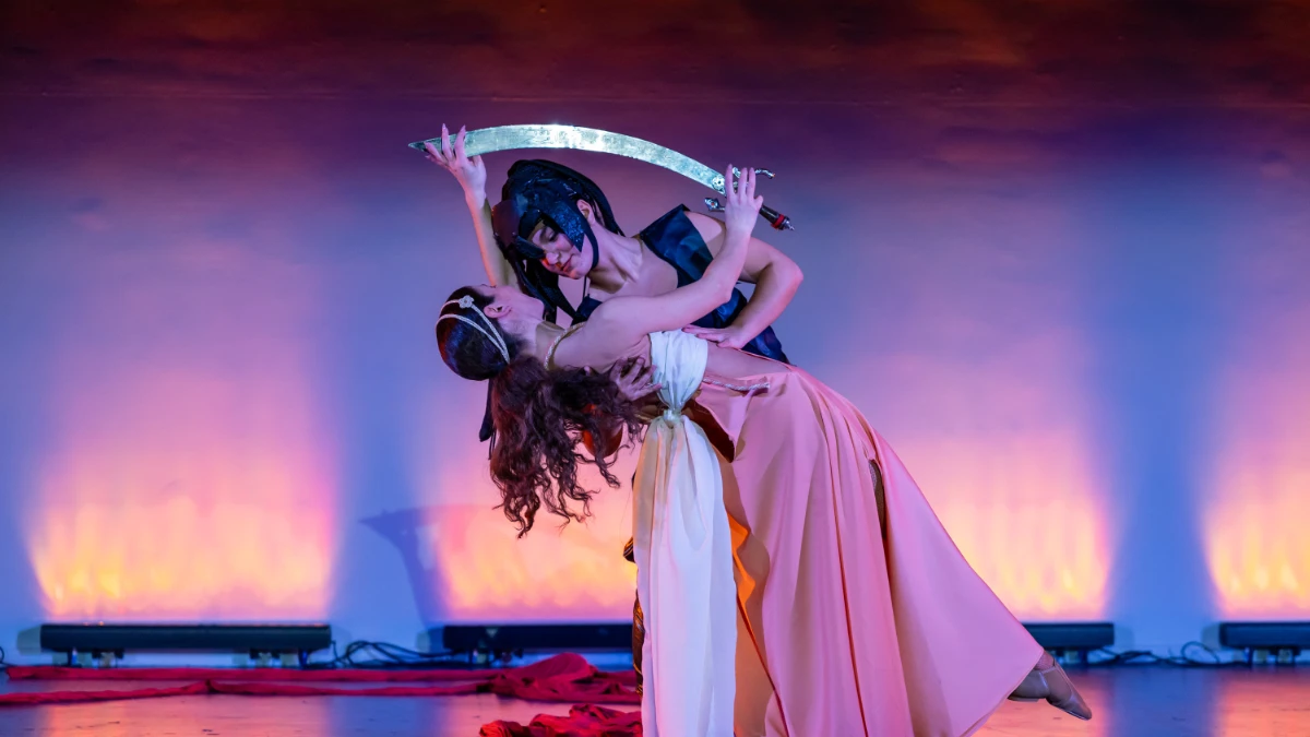 Ariadne guiding with the thread and sword in a dramatic dance theatre scene inspired by Greek mythology